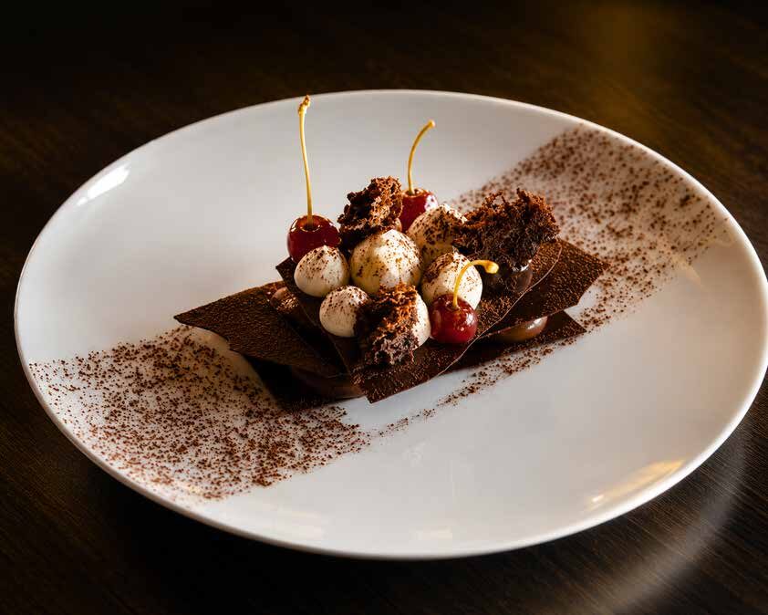 Chocolate dessert plated with cream